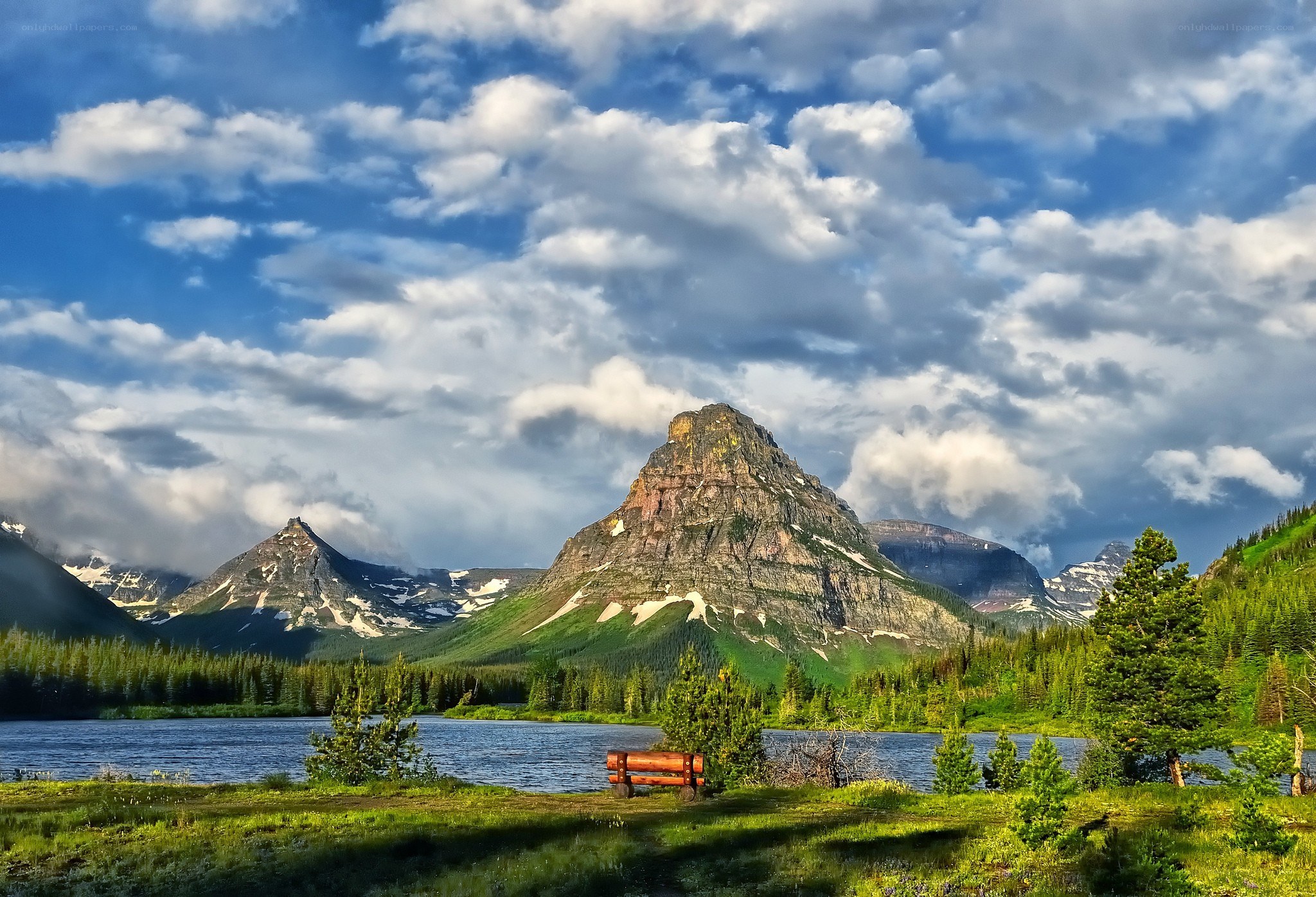 Mountain lake landscape with bench