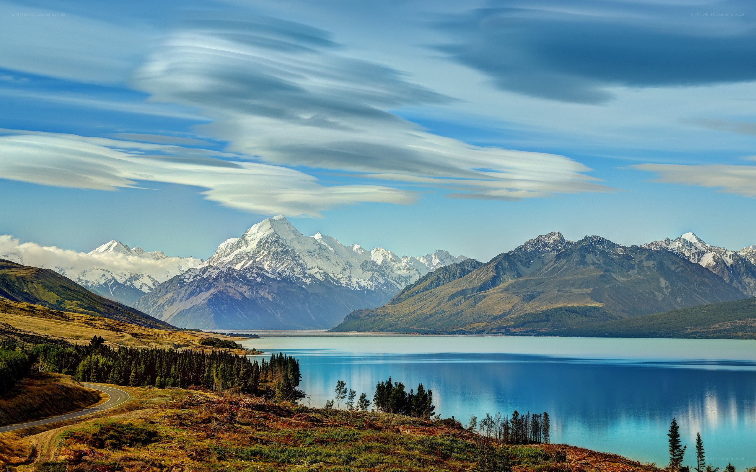 Mountain lake landscape with snow-capped peaks