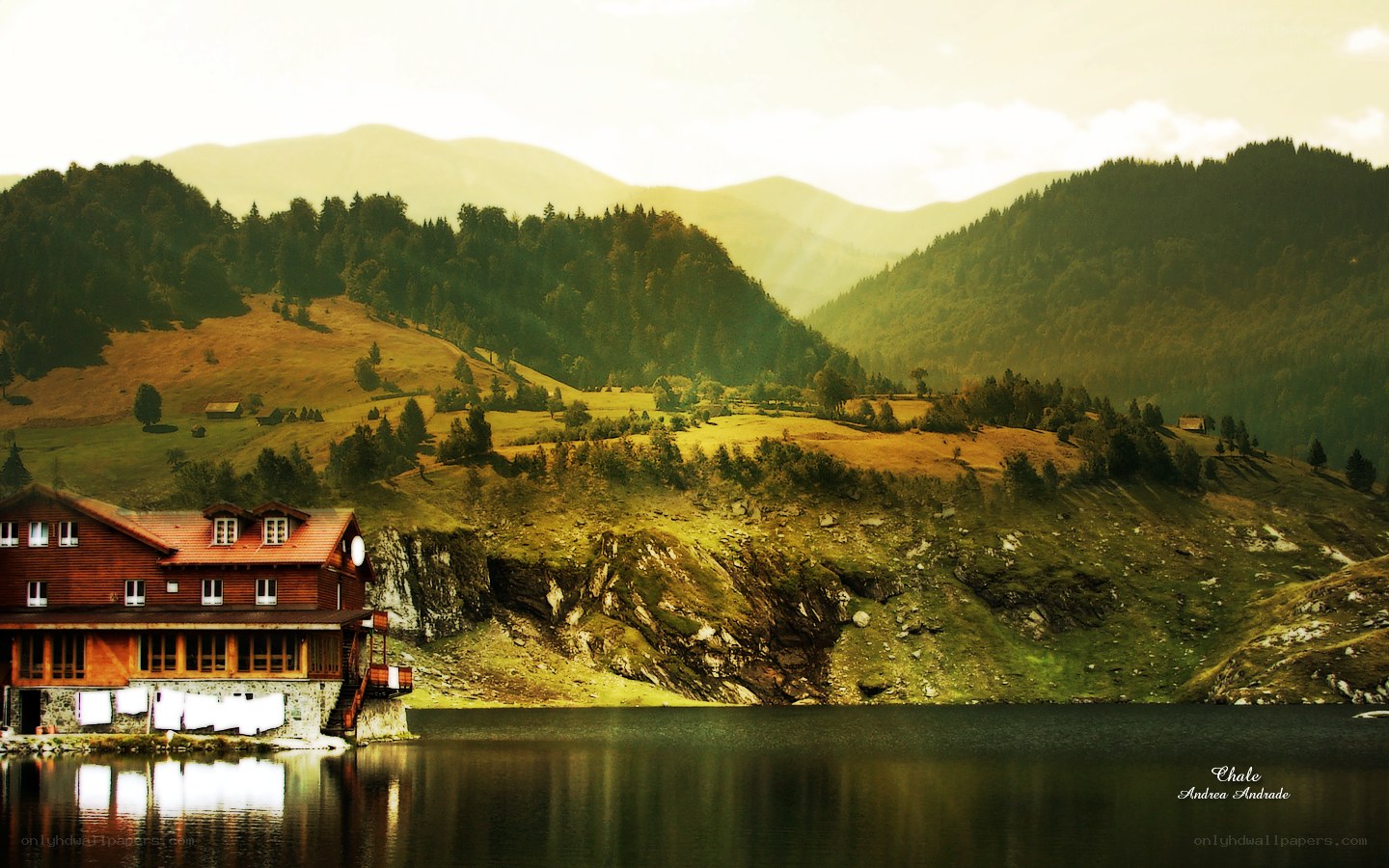 Mountain lake lodge at sunset
