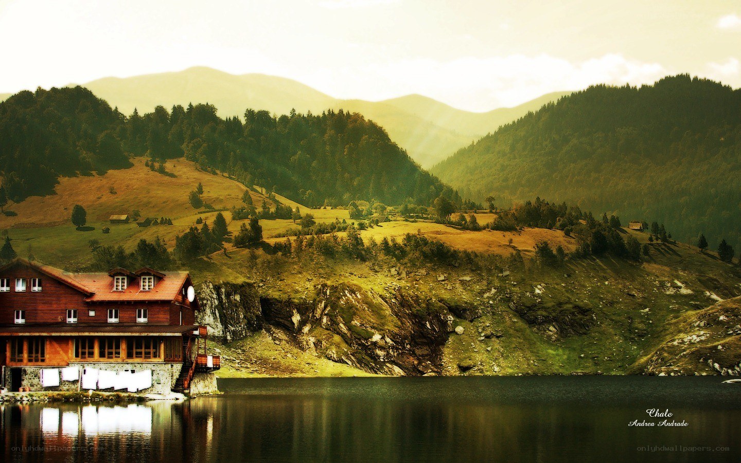 Mountain lake lodge at sunset