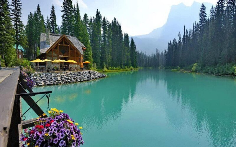Mountain lake lodge with turquoise water
