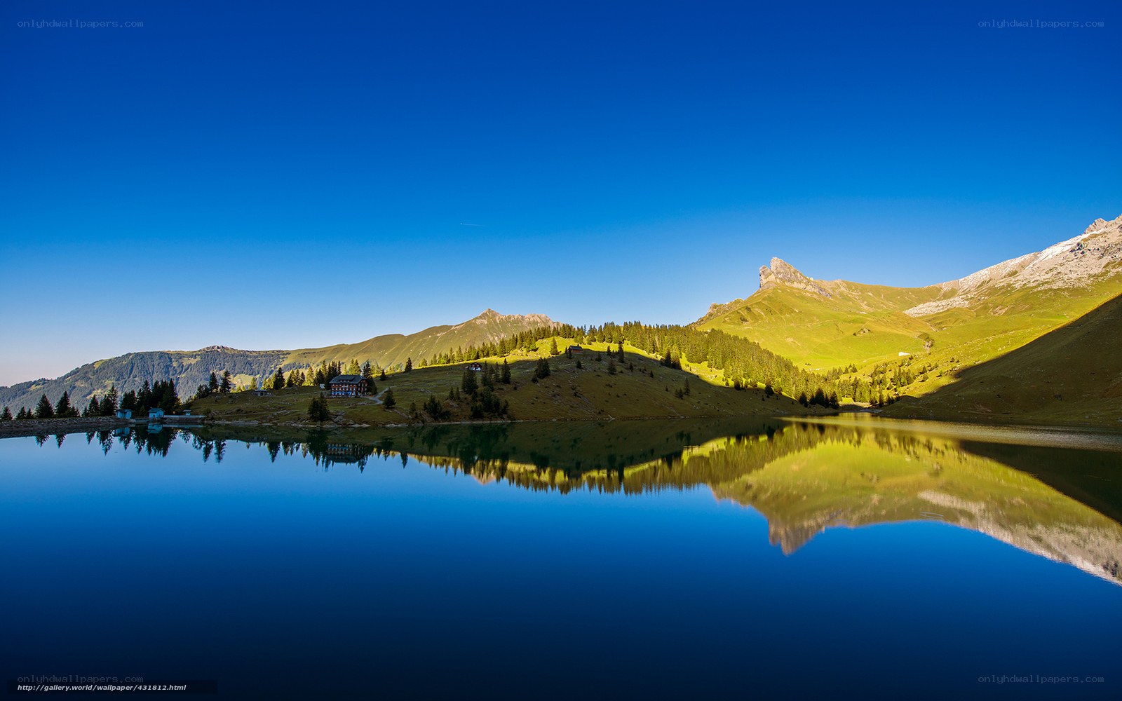 Mountain lake reflection at dawn