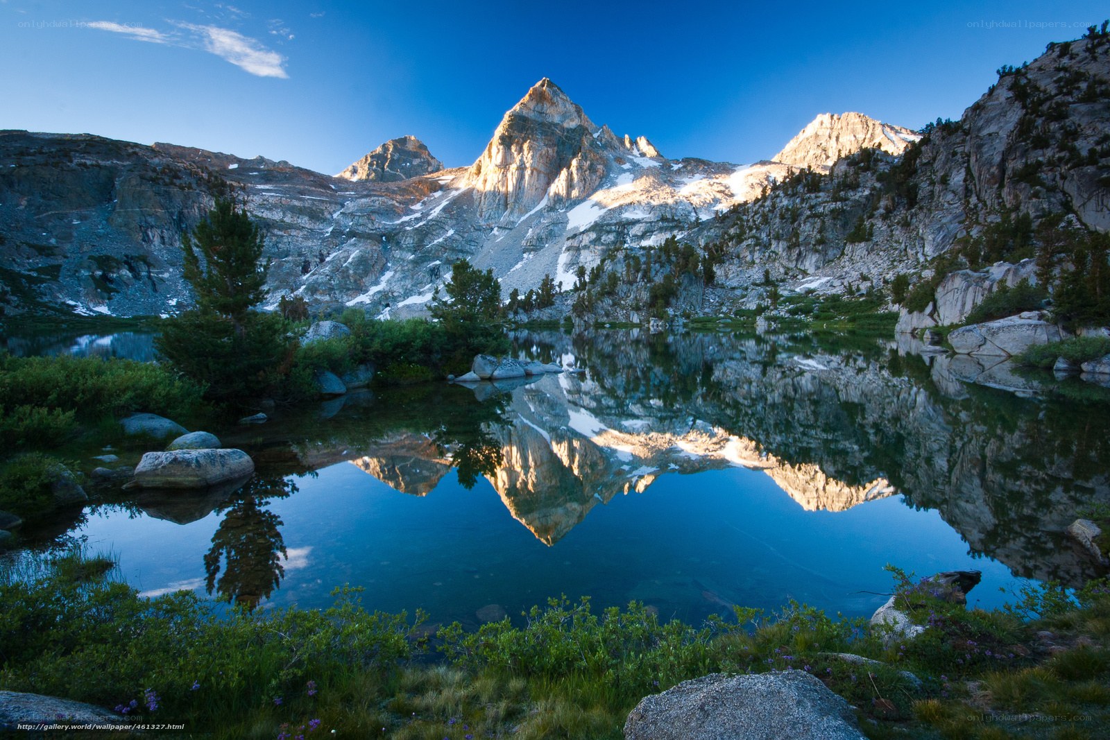 Mountain lake reflection at dawn