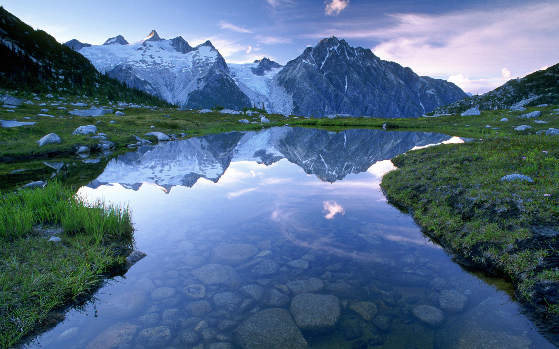 Mountain lake reflection at dawn