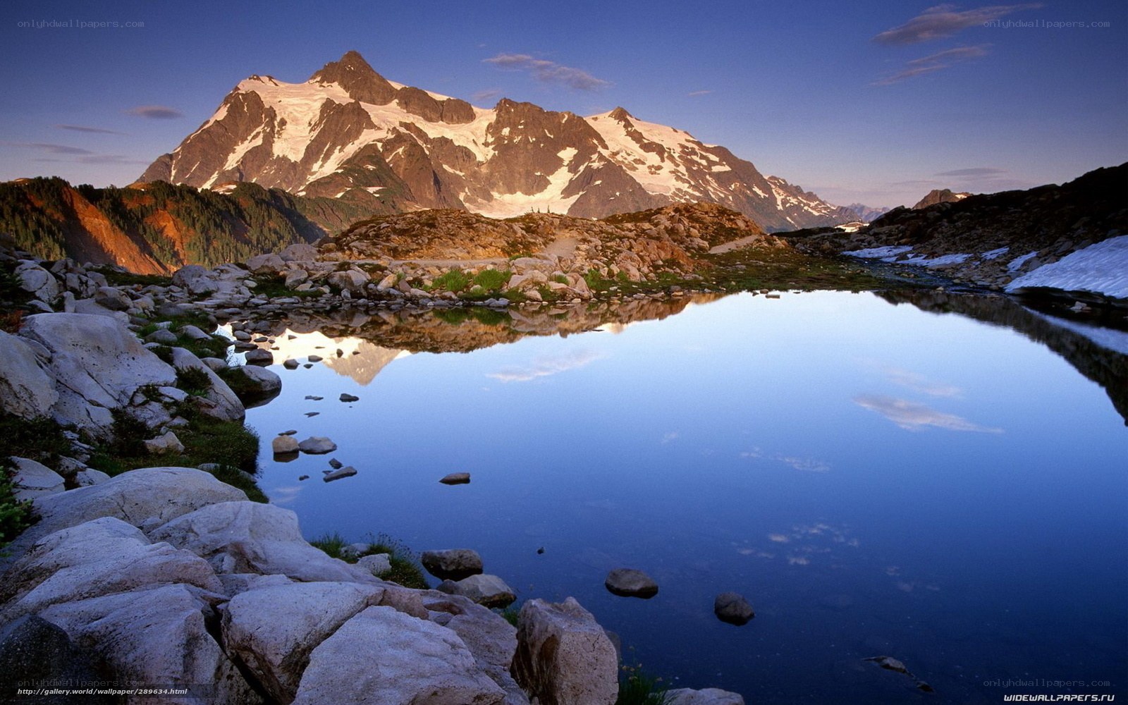 Mountain lake reflection at dawn