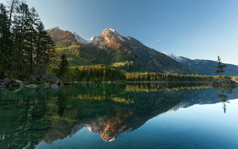 Mountain lake reflection at dawn