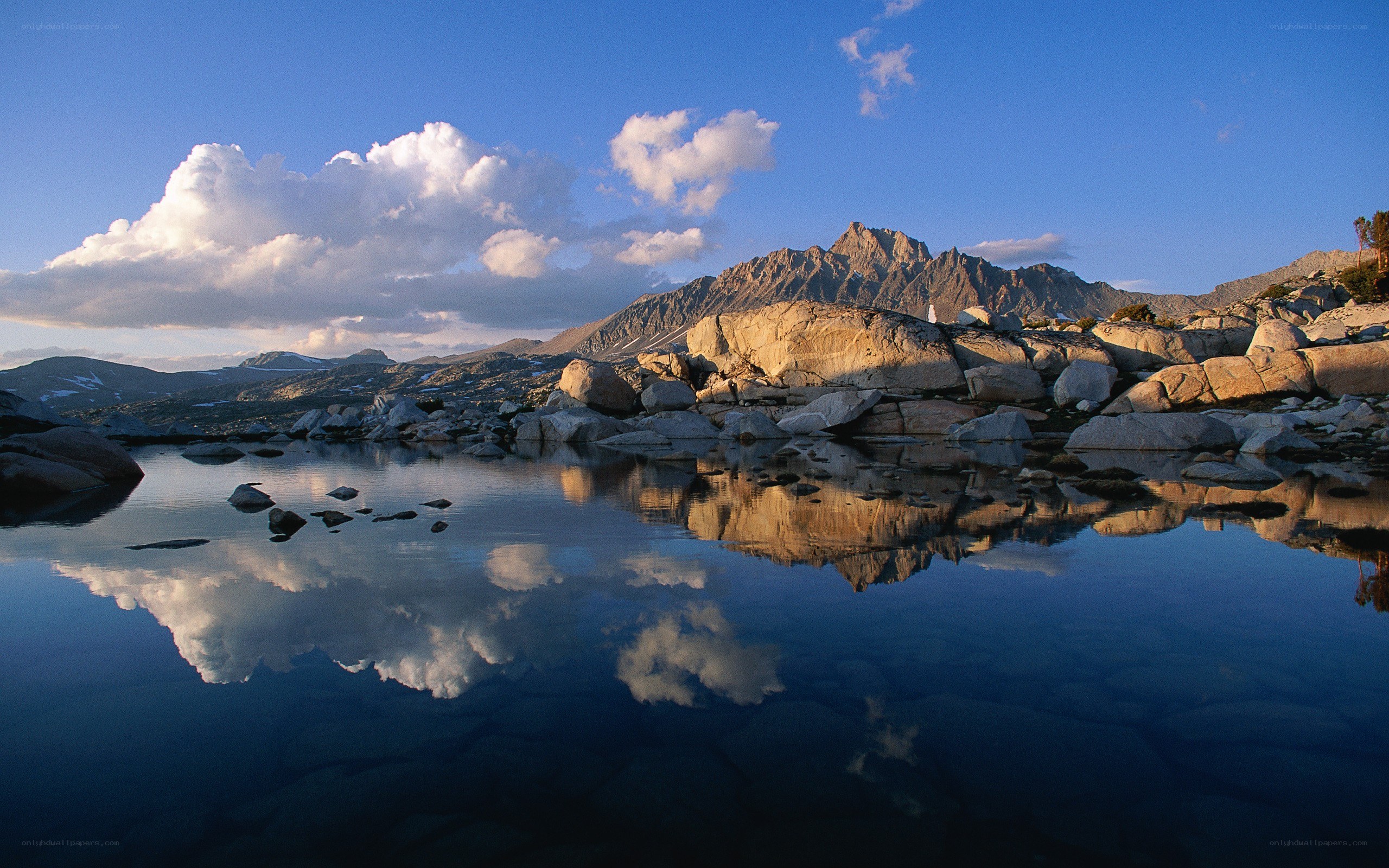 Mountain lake reflection at dawn