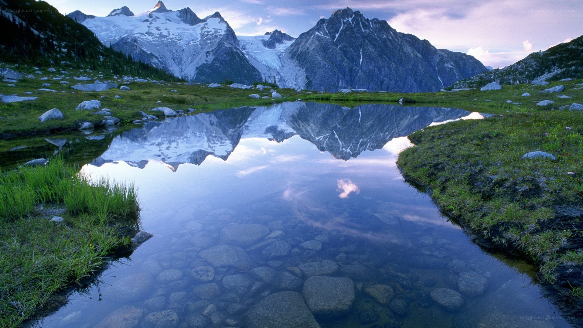 Mountain lake reflection at dawn