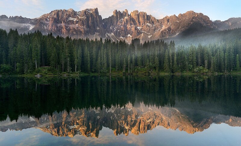Mountain lake reflection at dawn