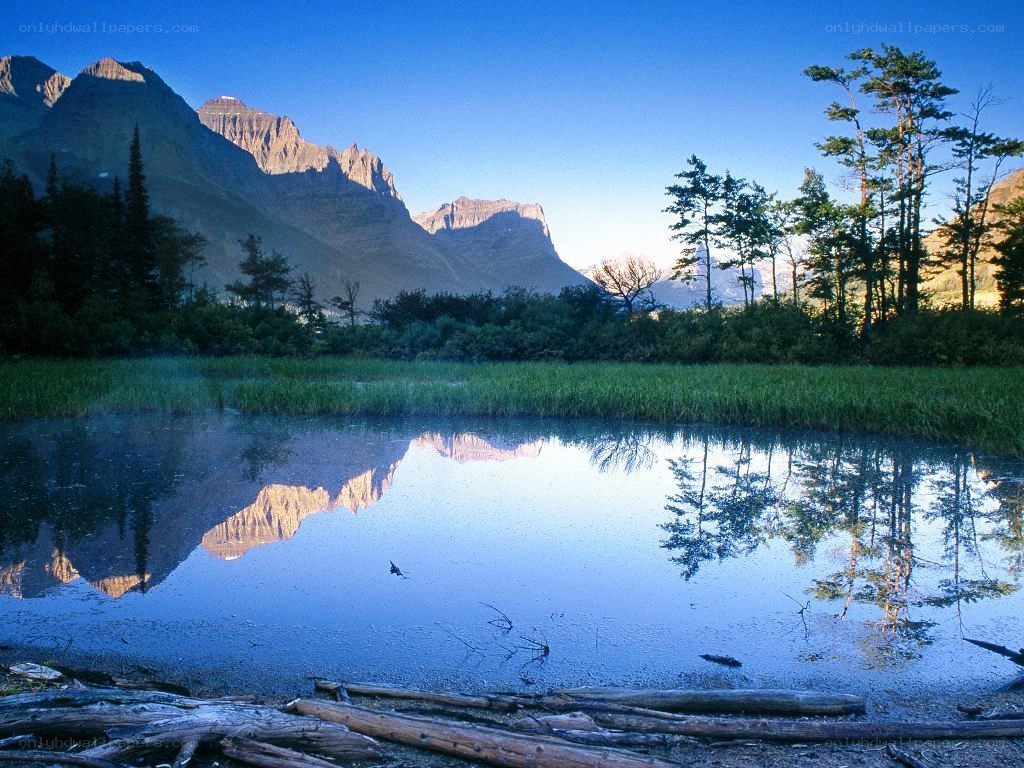 Mountain lake reflection at dawn