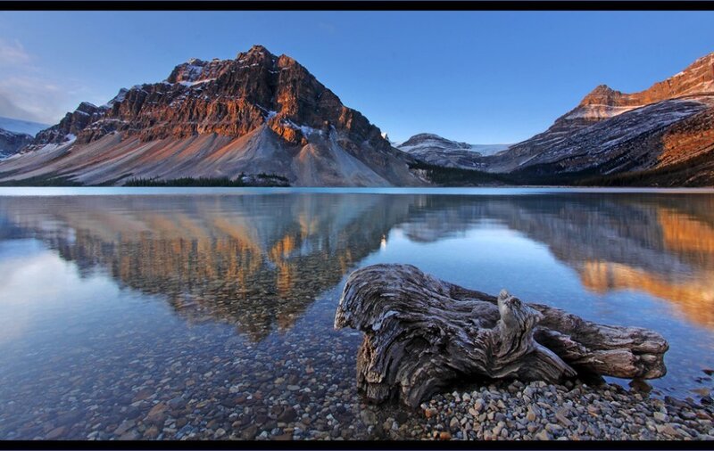 Mountain lake reflection at dawn