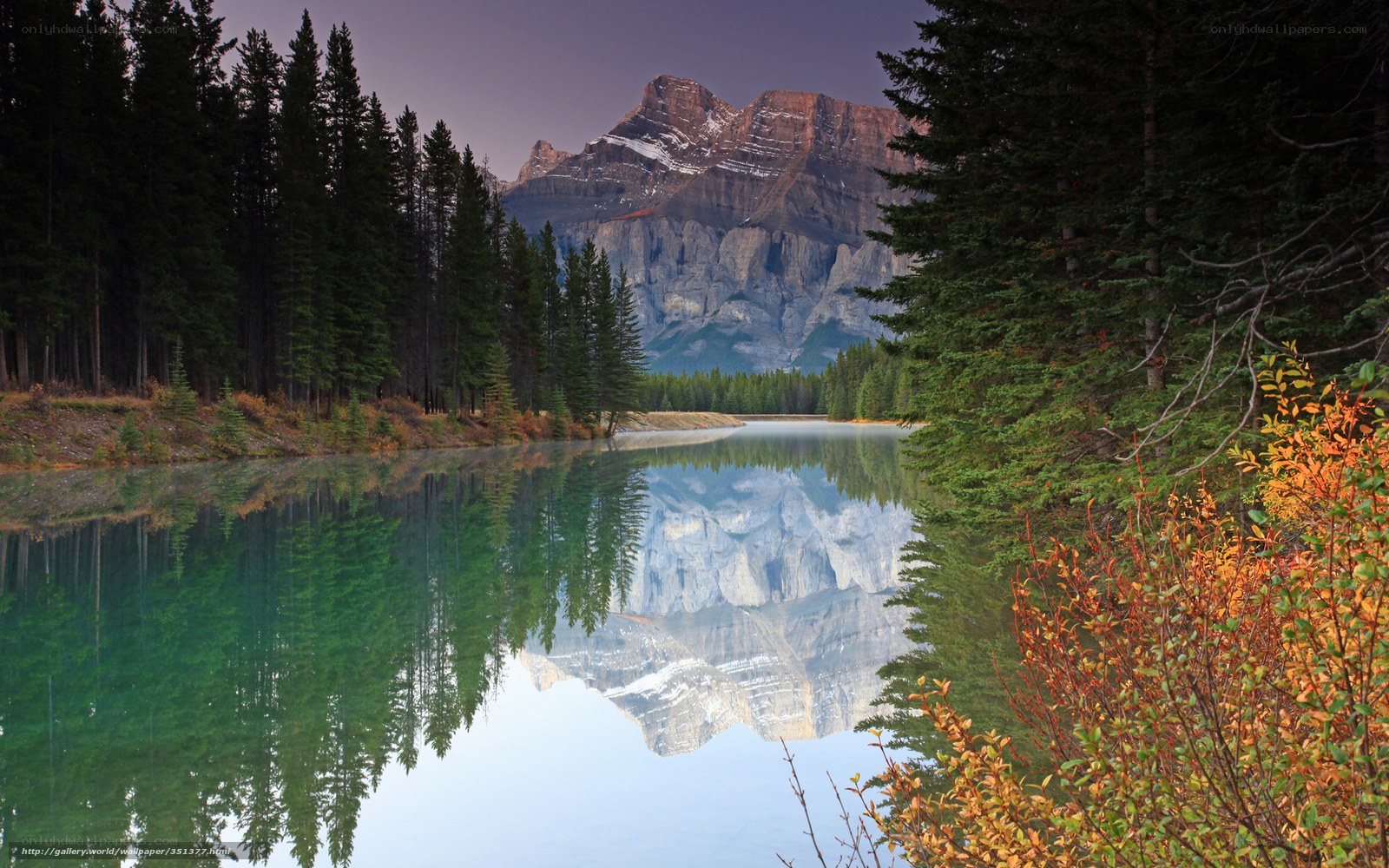 Mountain lake reflection at dusk