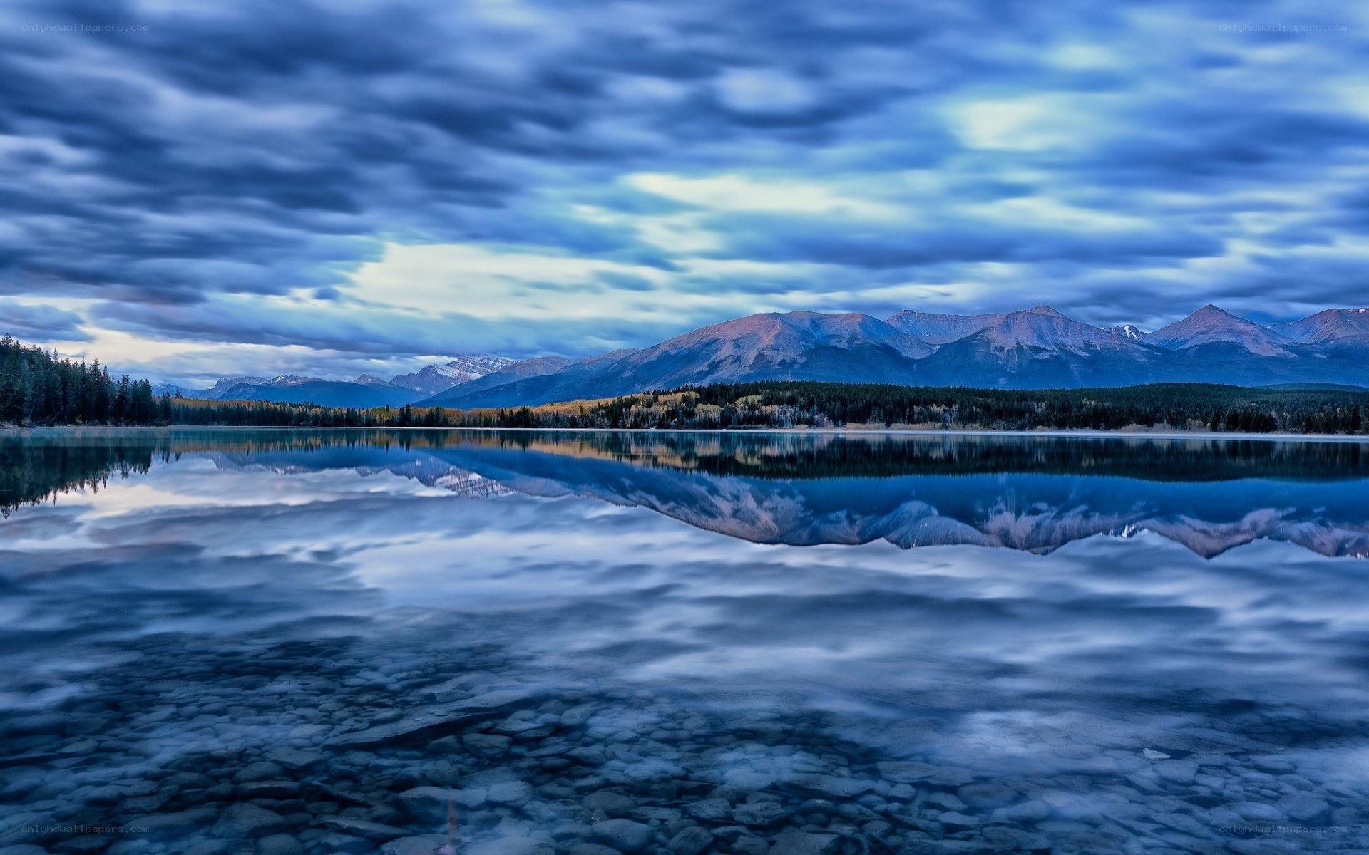 Mountain lake reflection at dusk