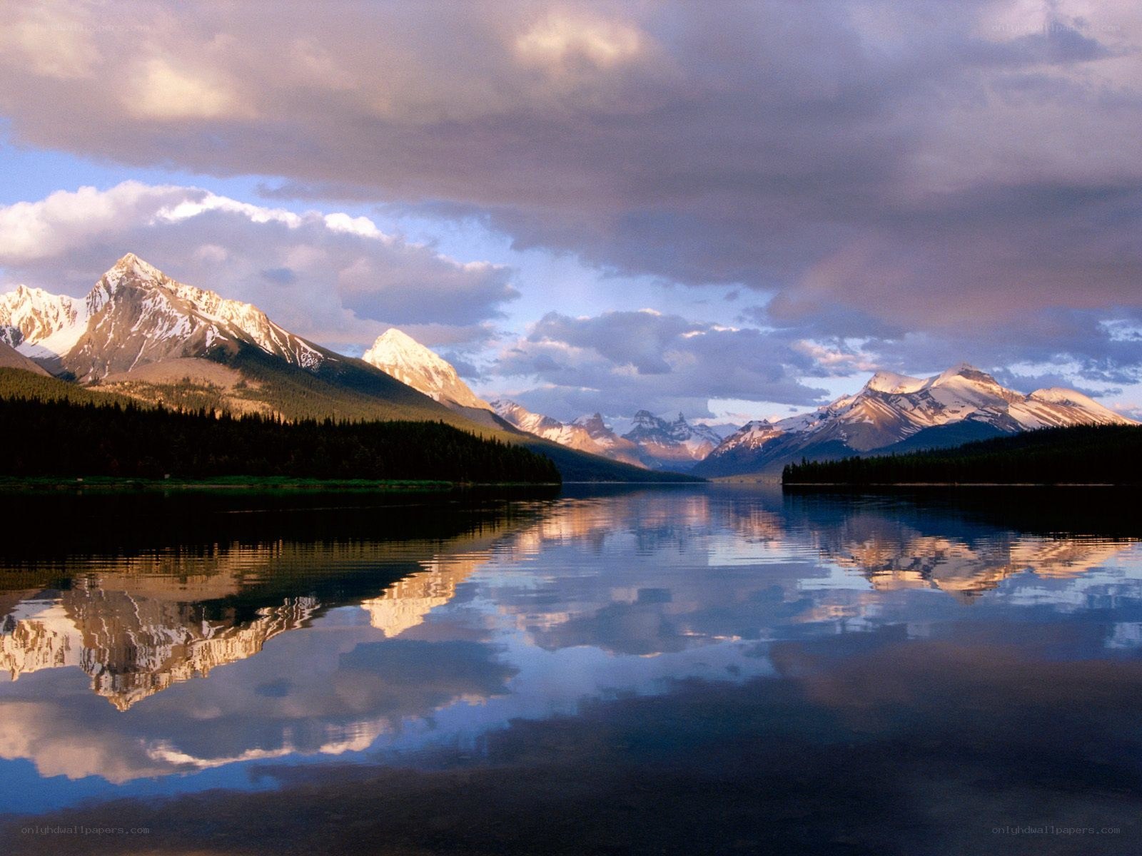 Mountain lake reflection at dusk
