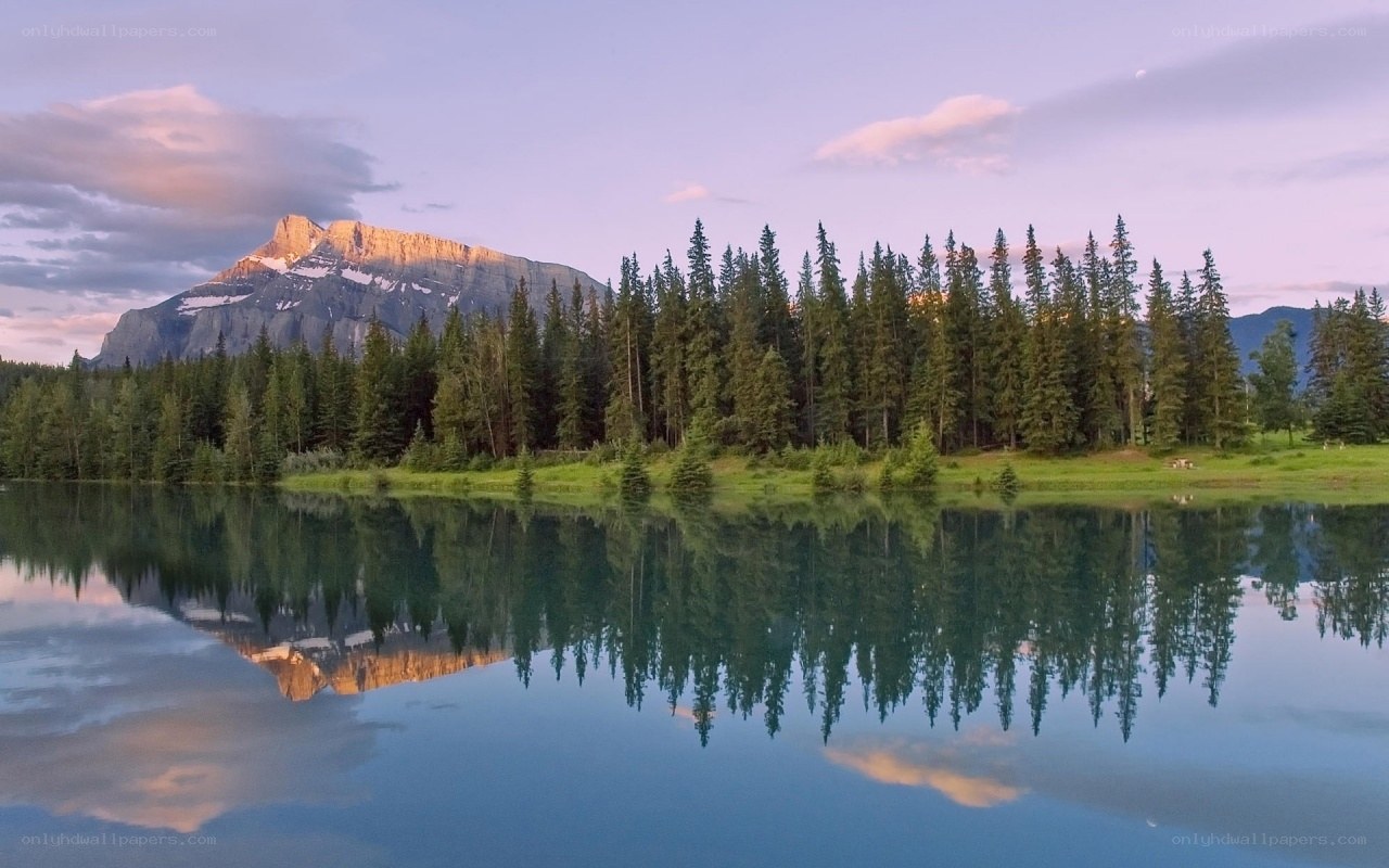 Mountain lake reflection at dusk