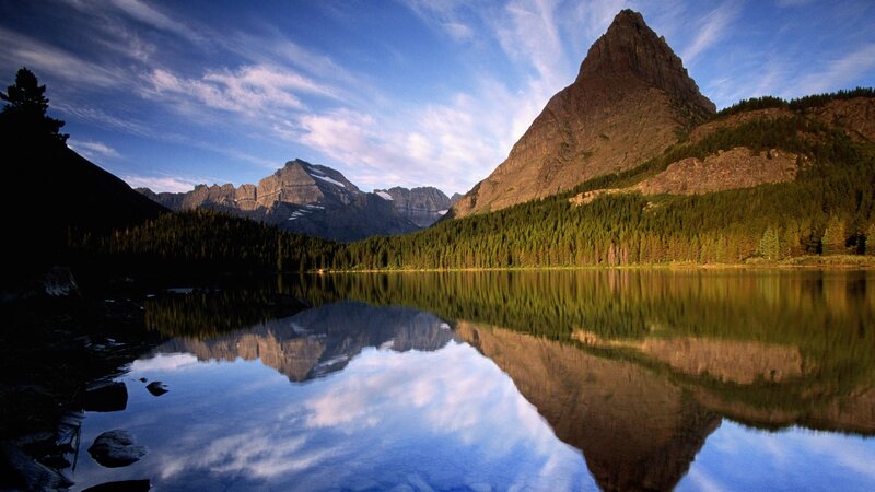 Mountain lake reflection at sunrise