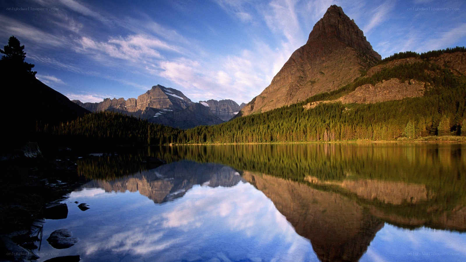 Mountain lake reflection at sunrise