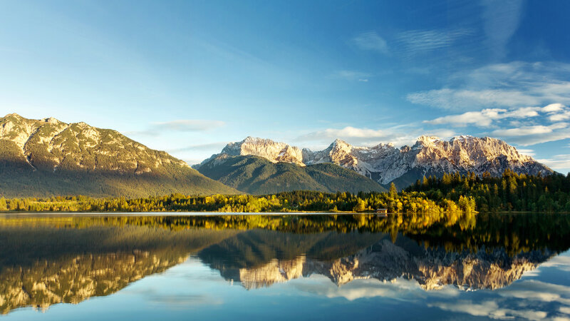 Mountain lake reflection at sunrise