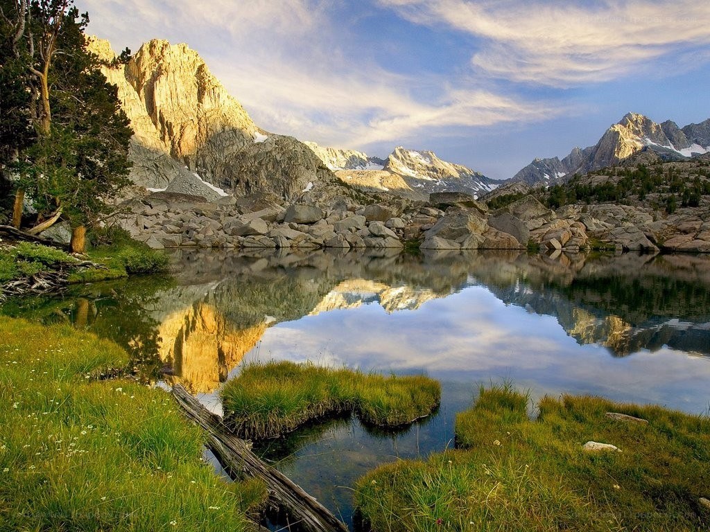Mountain lake reflection at sunrise