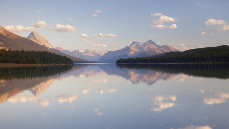 Mountain lake reflection at sunrise