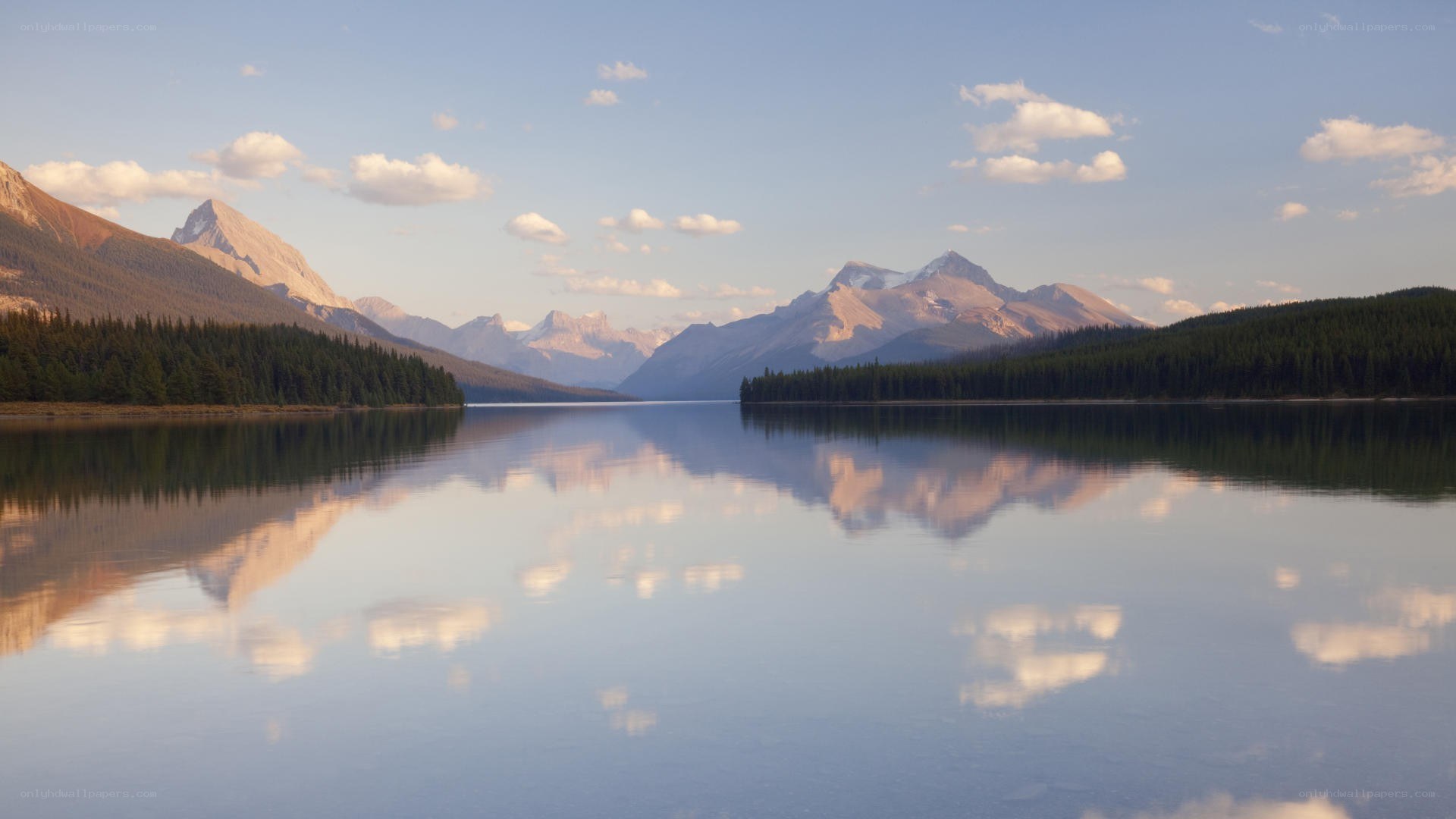 Mountain lake reflection at sunrise