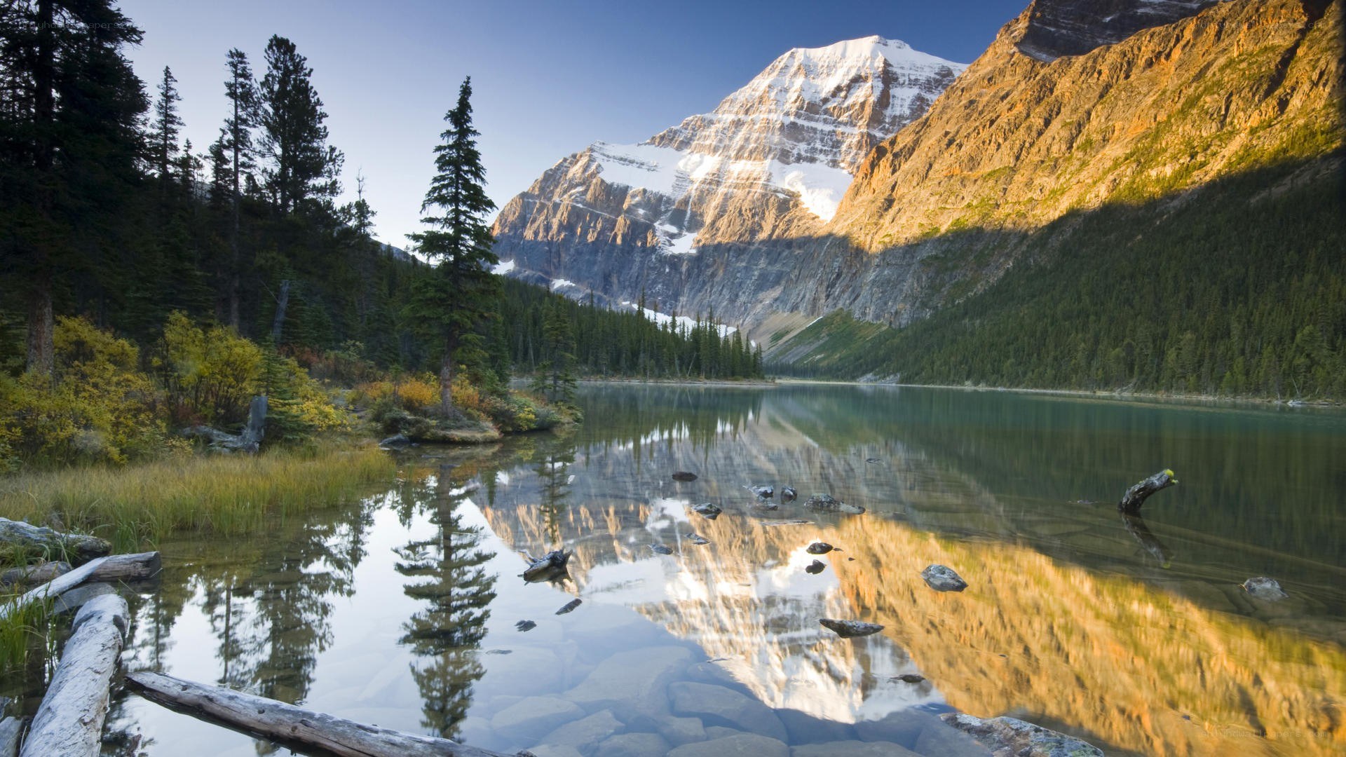 Mountain lake reflection at sunrise