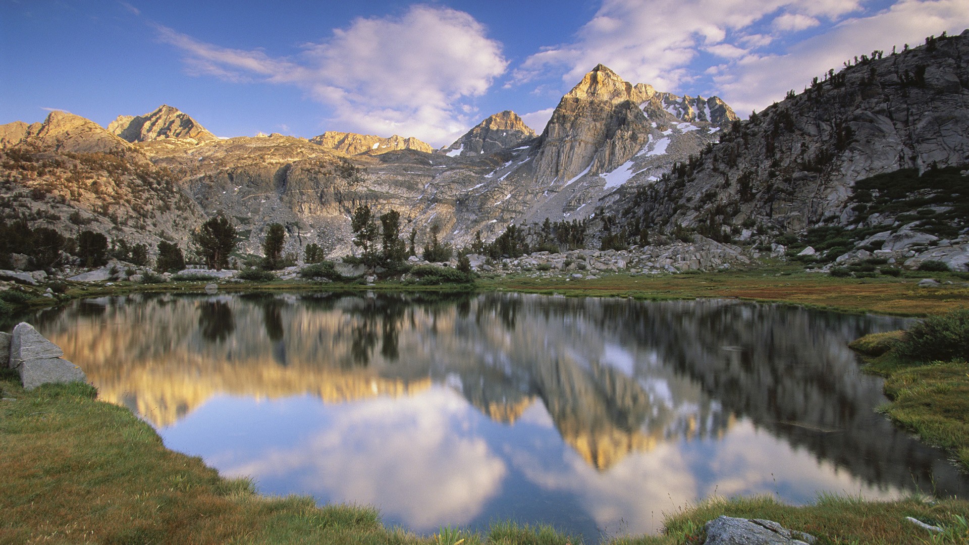 Mountain lake reflection at sunrise
