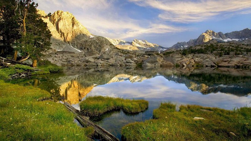 Mountain lake reflection at sunrise