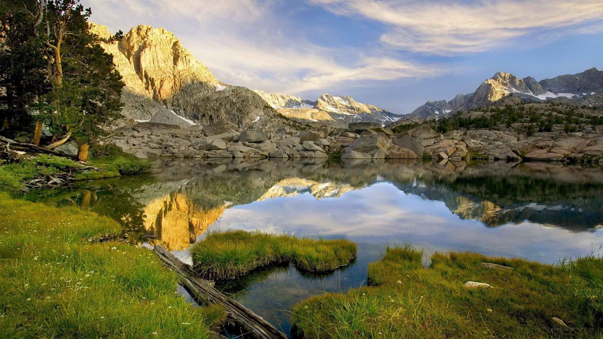 Mountain lake reflection at sunrise