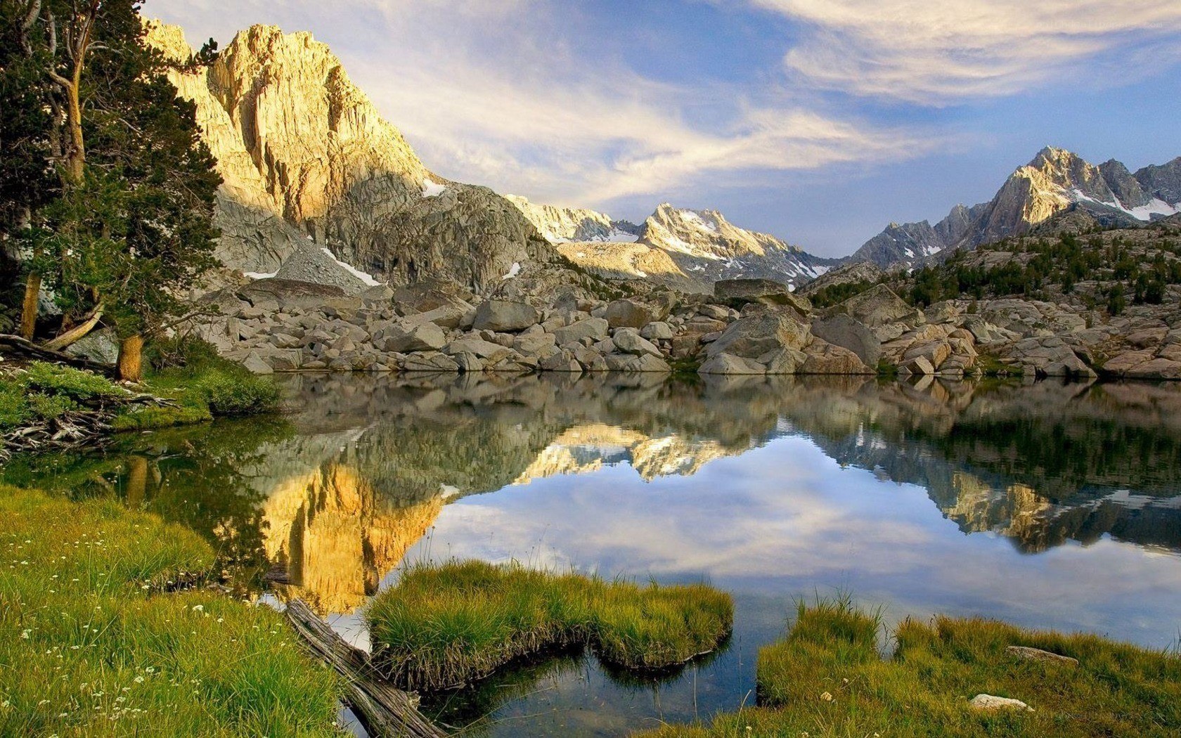 Mountain lake reflection at sunrise