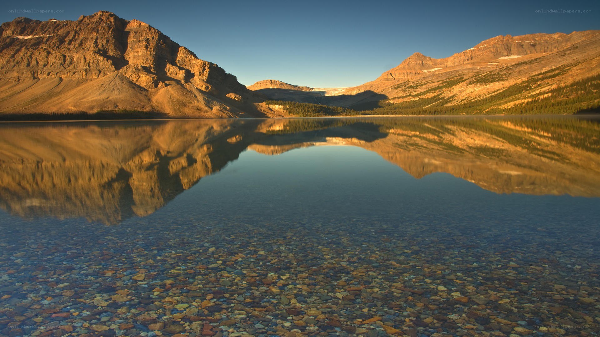 Mountain lake reflection at sunrise
