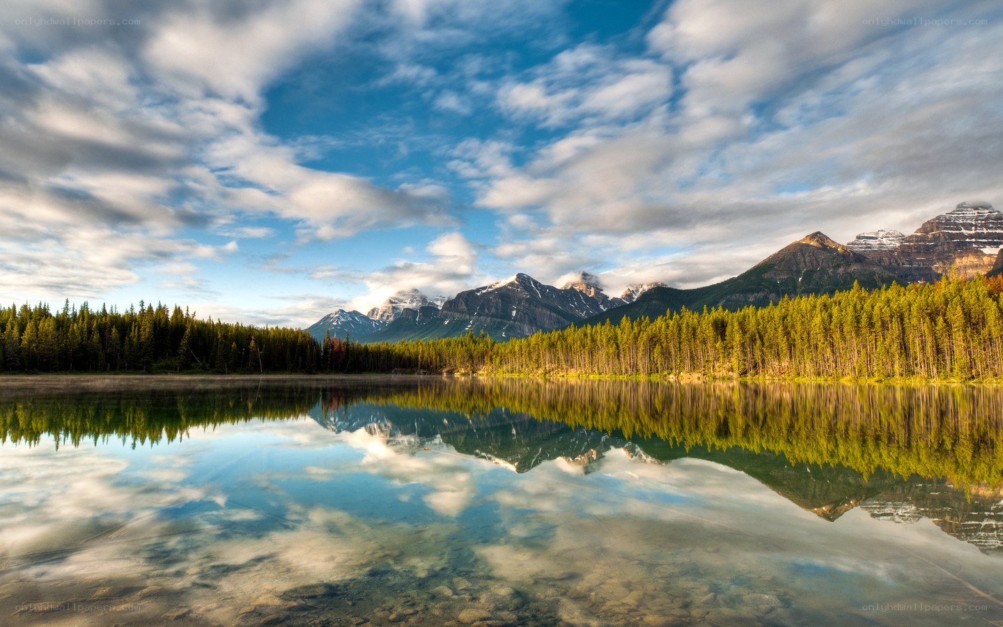 Mountain lake reflection at sunrise