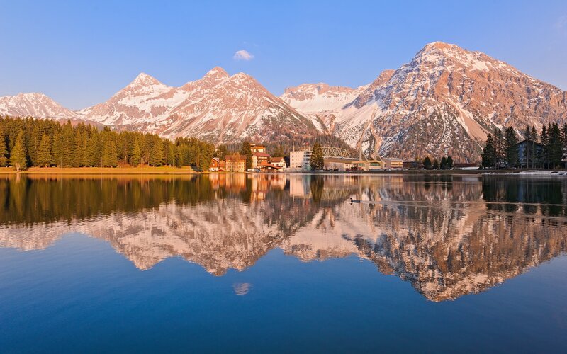 Mountain lake reflection at sunrise
