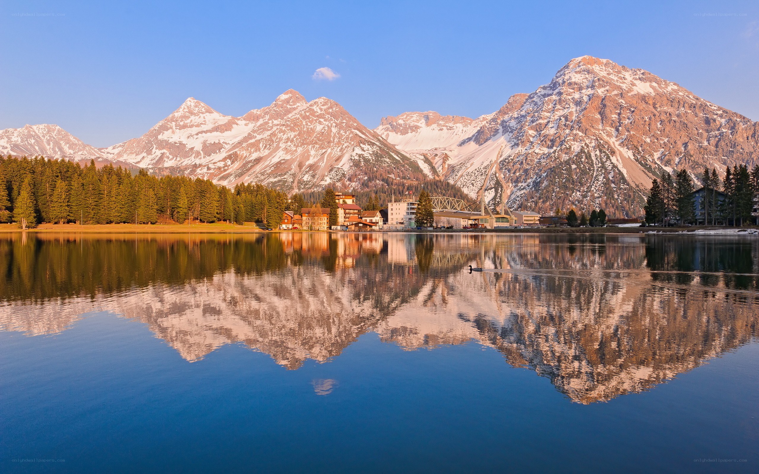 Mountain lake reflection at sunrise