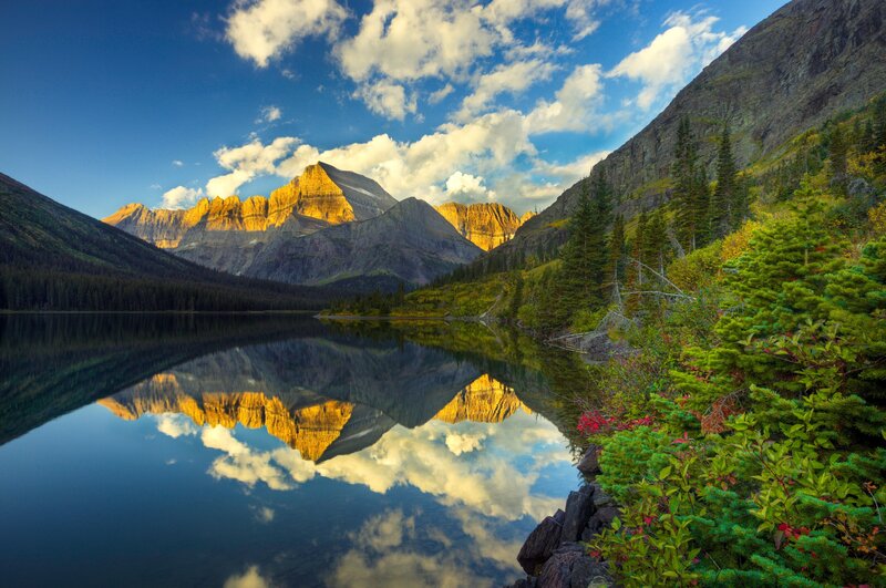 Mountain lake reflection at sunrise