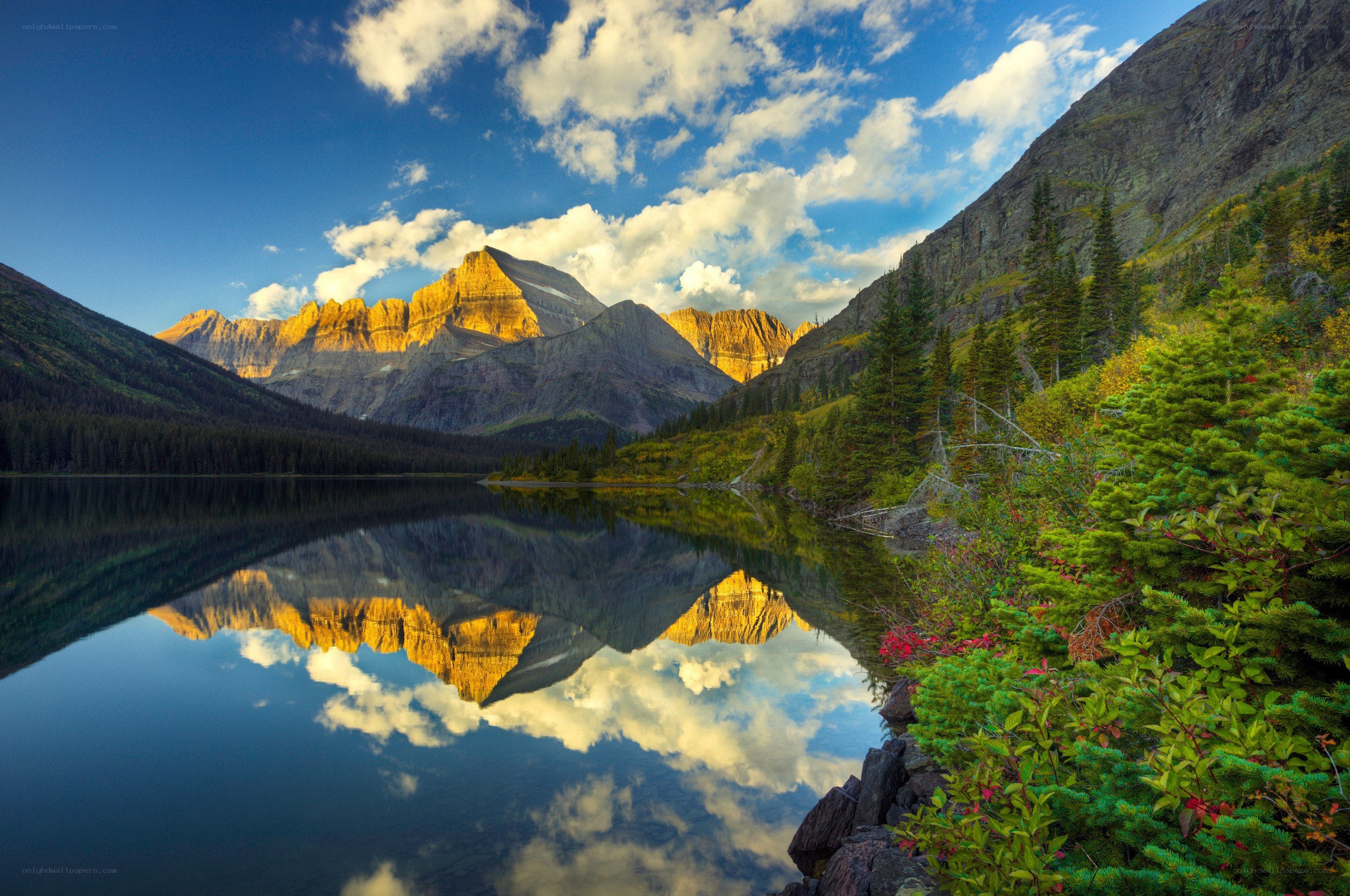 Mountain lake reflection at sunrise