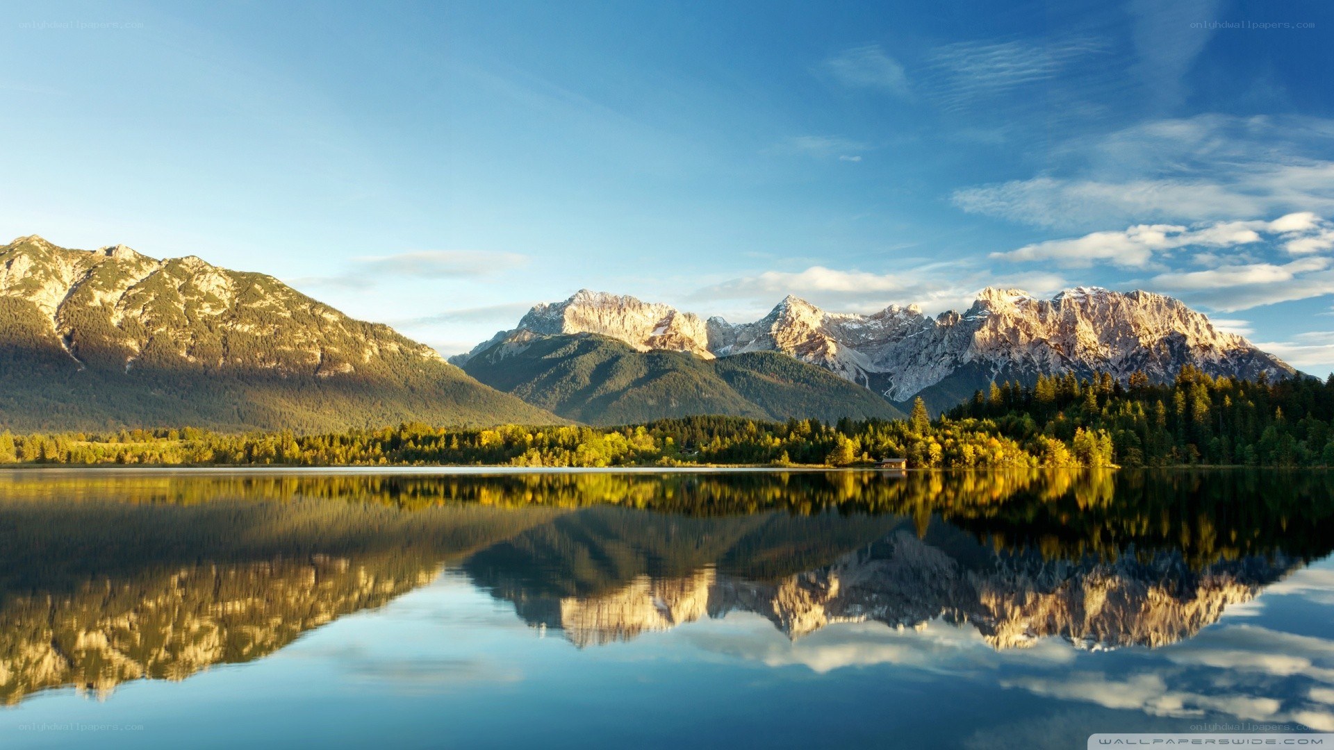 Mountain lake reflection at sunrise