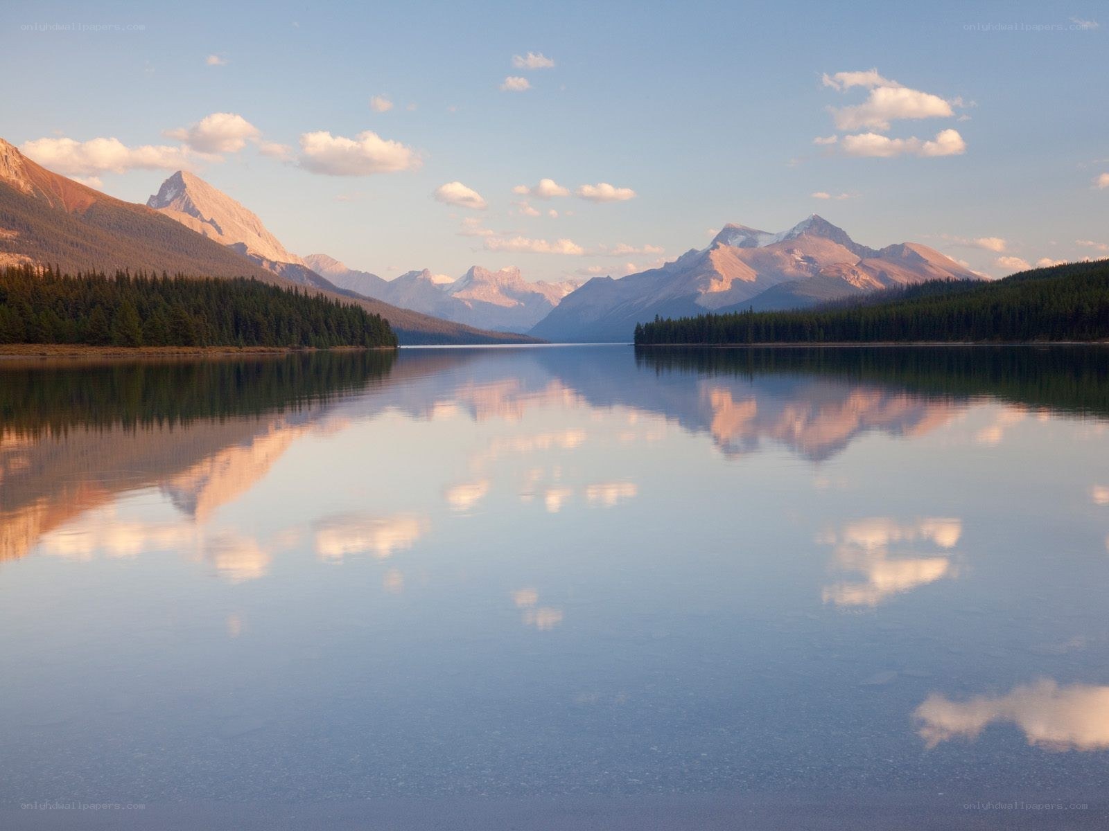 Mountain lake reflection at sunrise