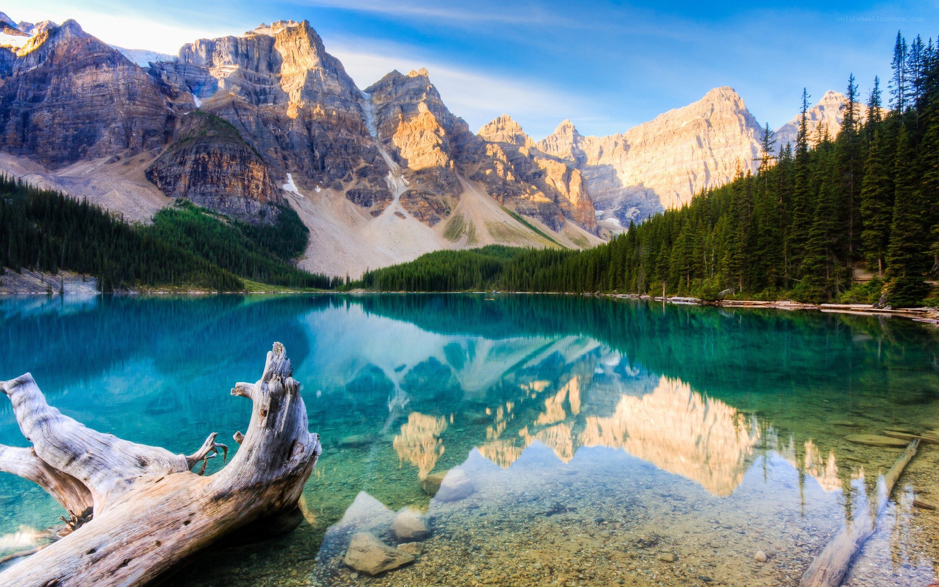 Mountain lake reflection at sunrise