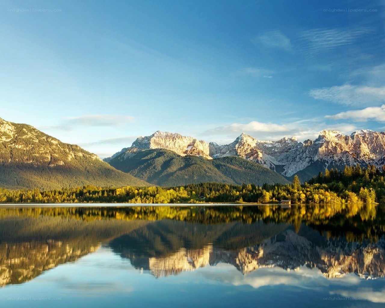 Mountain lake reflection at sunrise