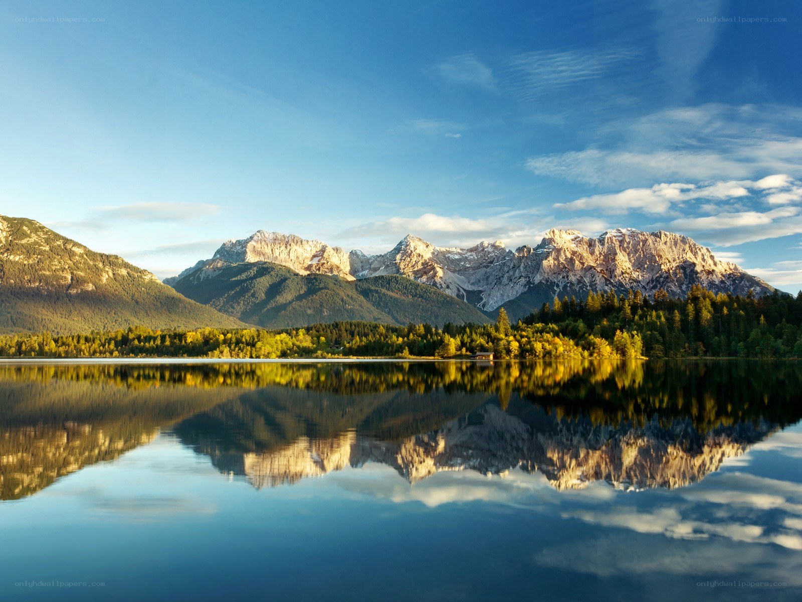Mountain lake reflection at sunrise