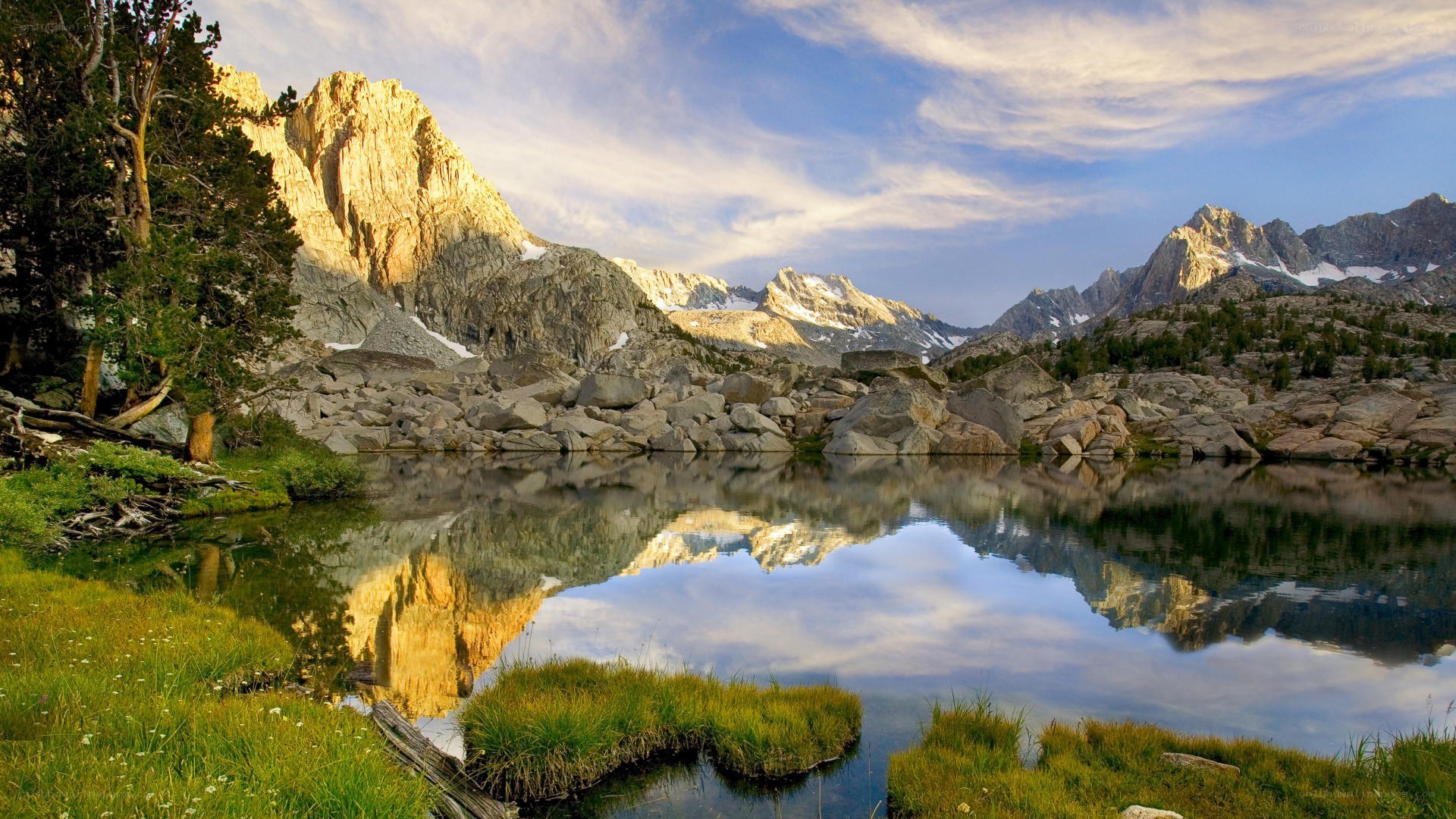 Mountain lake reflection at sunrise