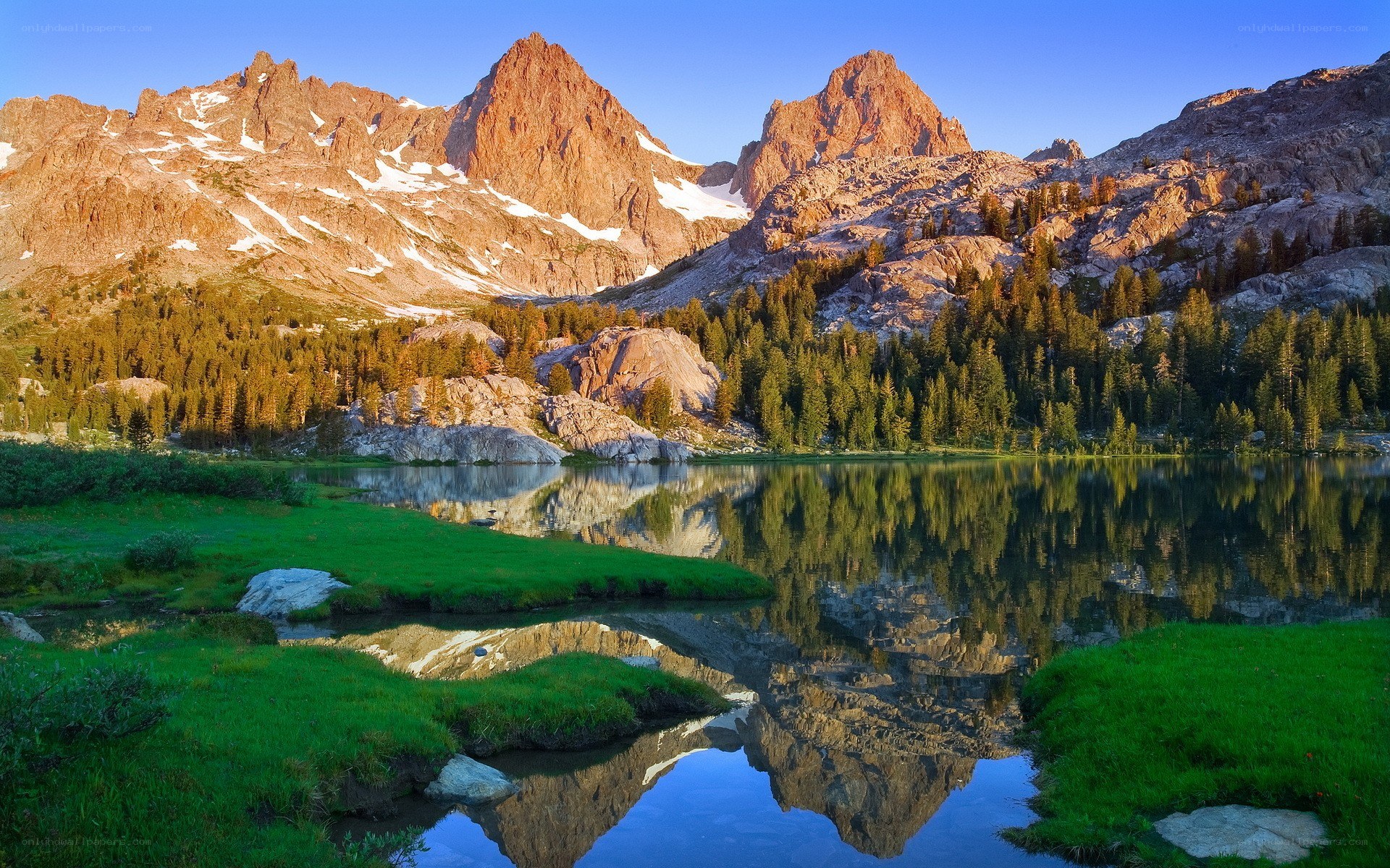 Mountain lake reflection at sunrise