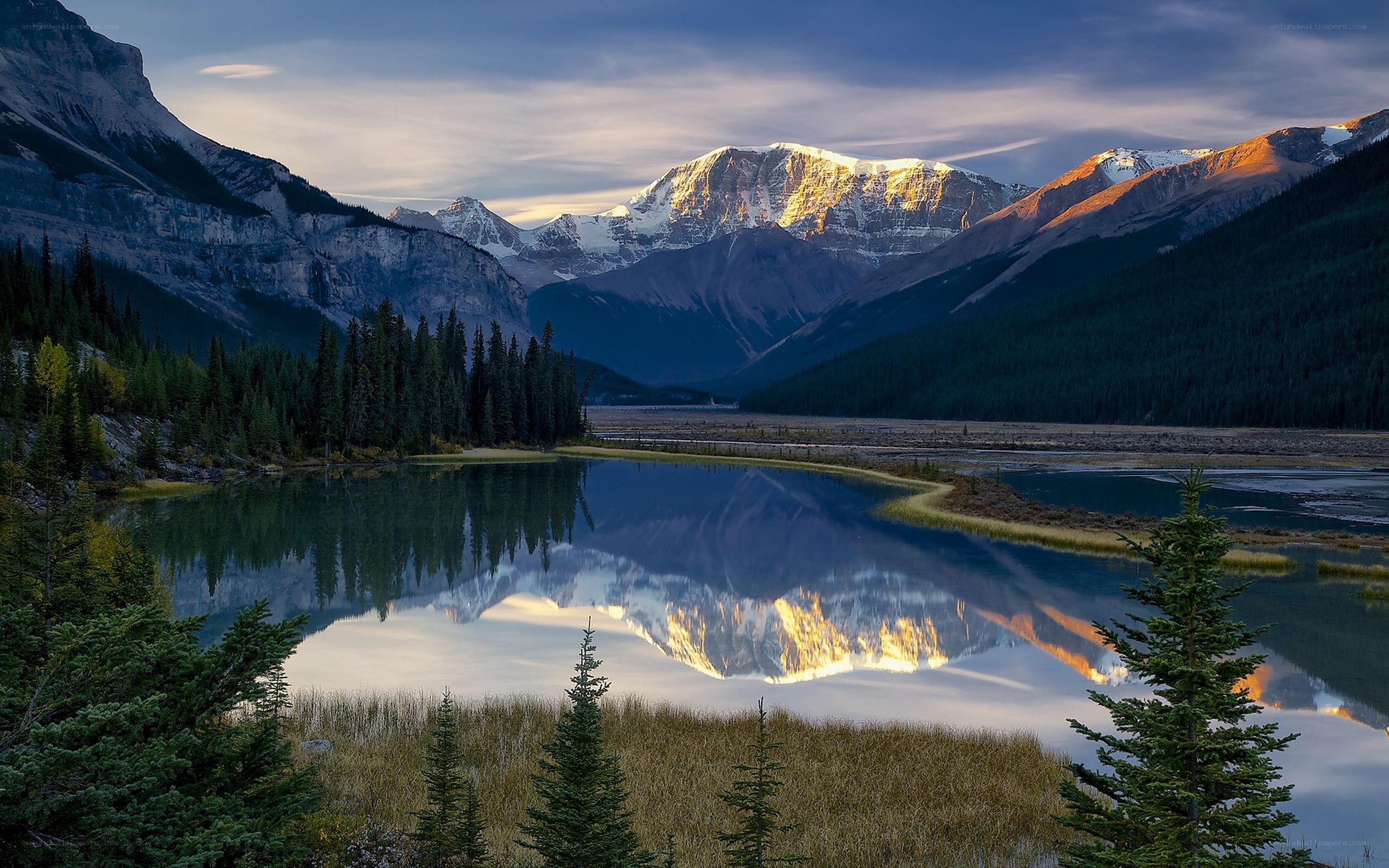 Mountain lake reflection at sunrise