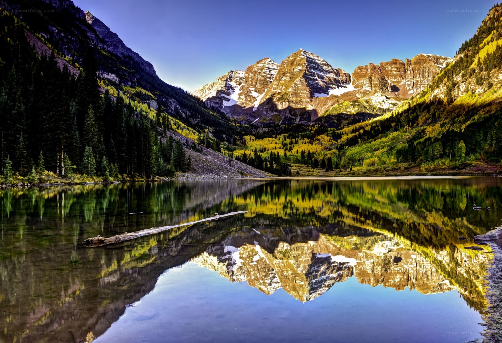 Mountain lake reflection at sunrise