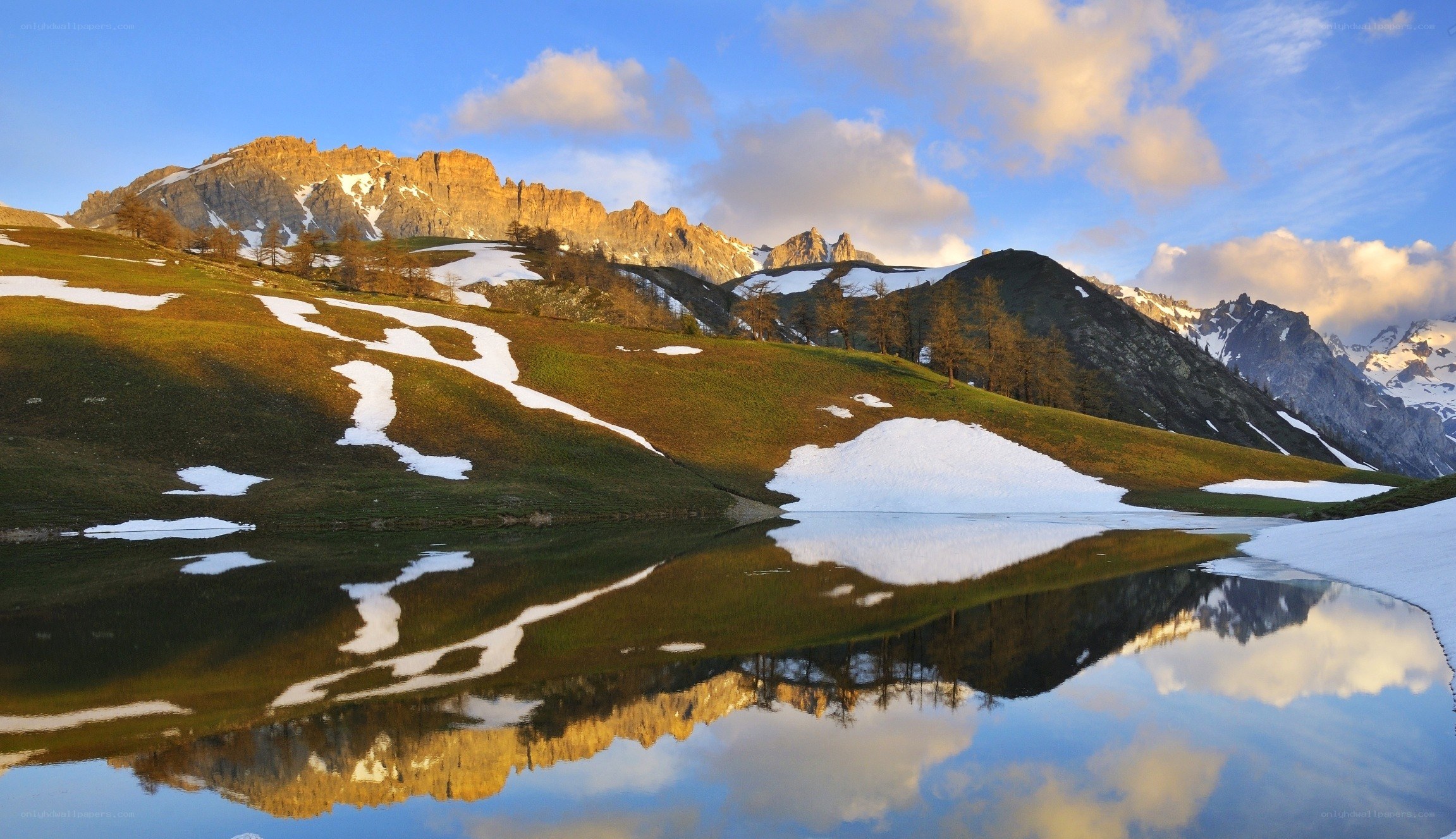 Mountain lake reflection at sunrise