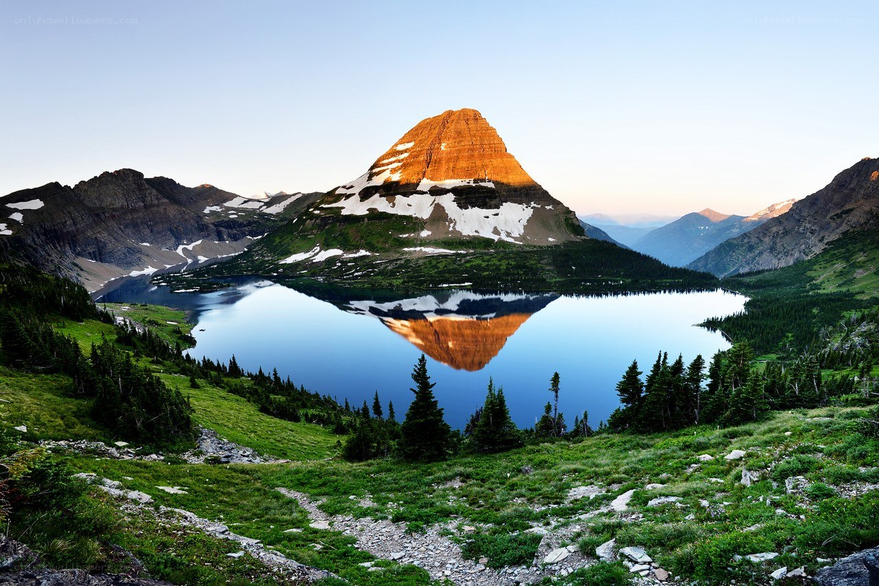 Mountain lake reflection at sunrise