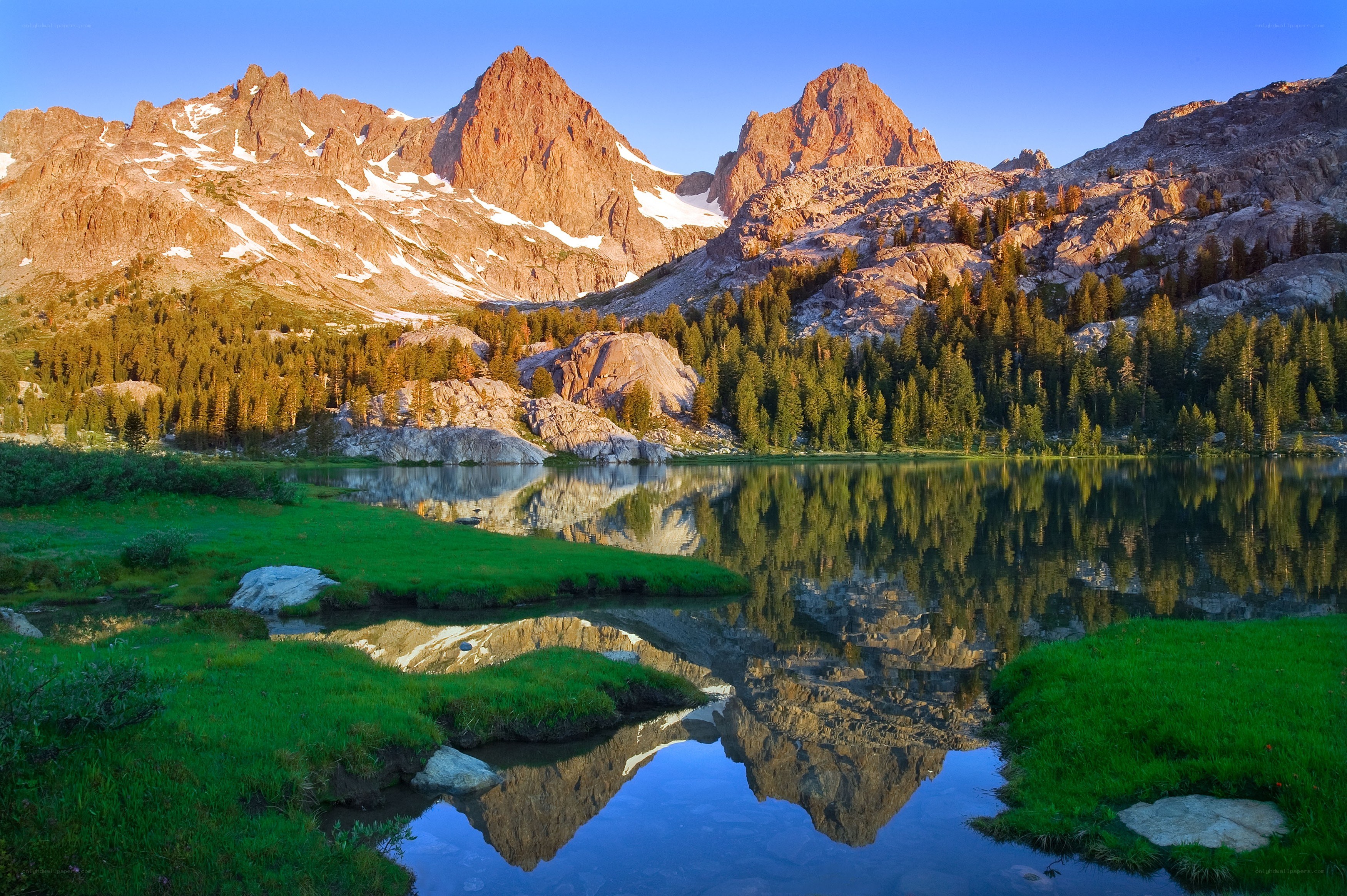 Mountain lake reflection at sunrise