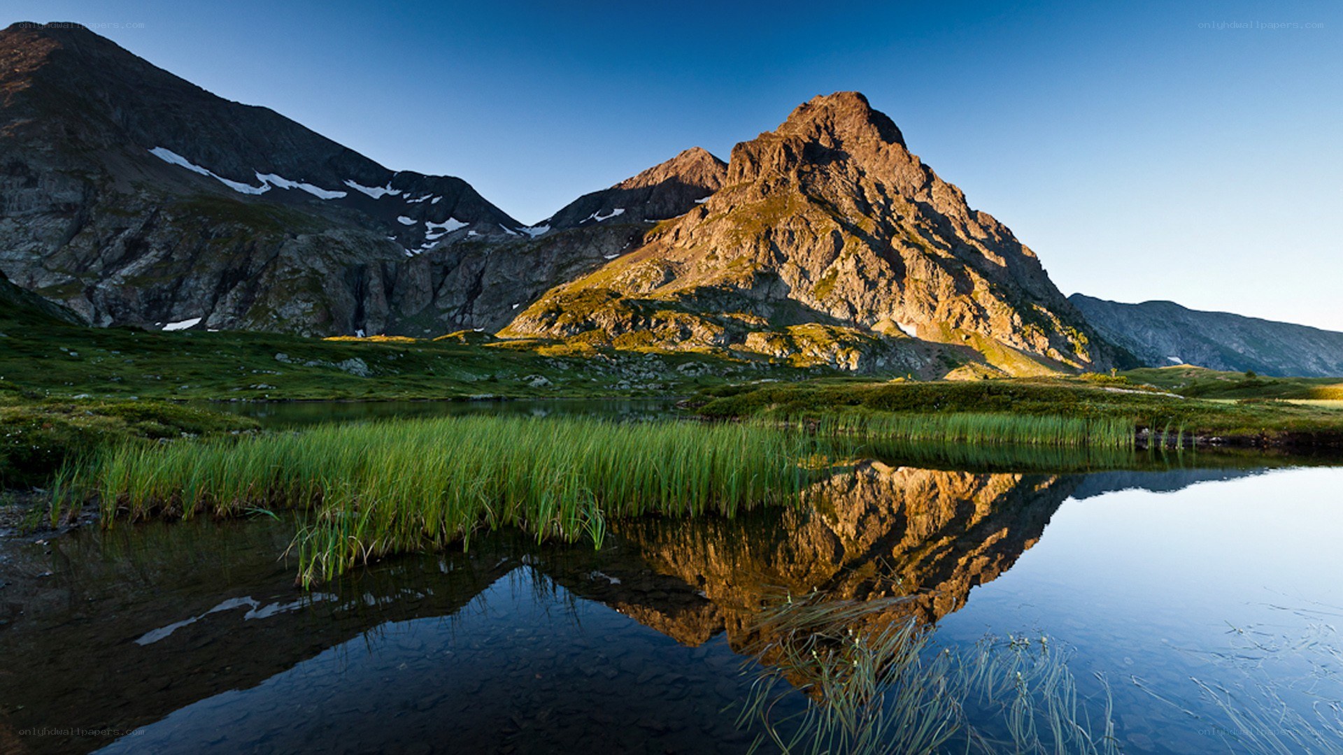 Mountain lake reflection at sunrise