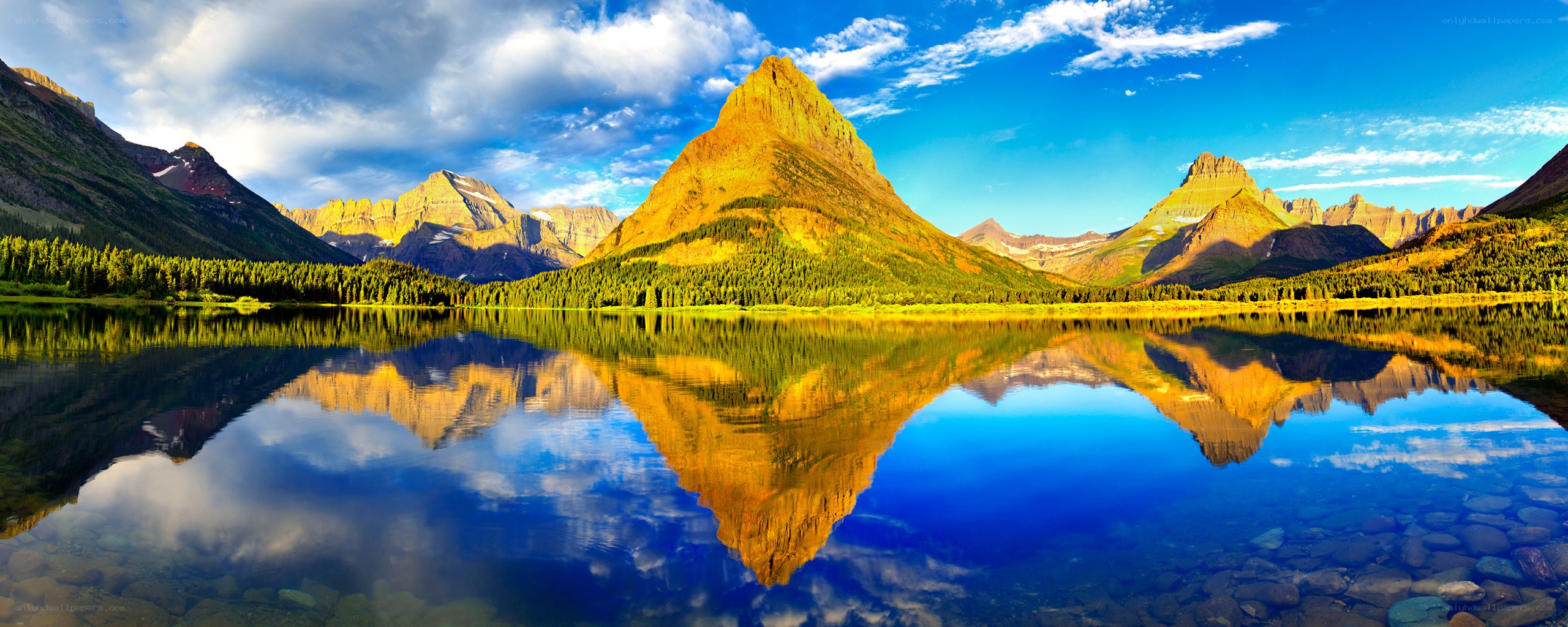 Mountain lake reflection at sunrise